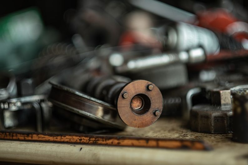 Vehicle Maintenance - a close up of a metal object on a table