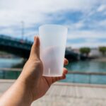 Reusable Product - a hand holding a white cup