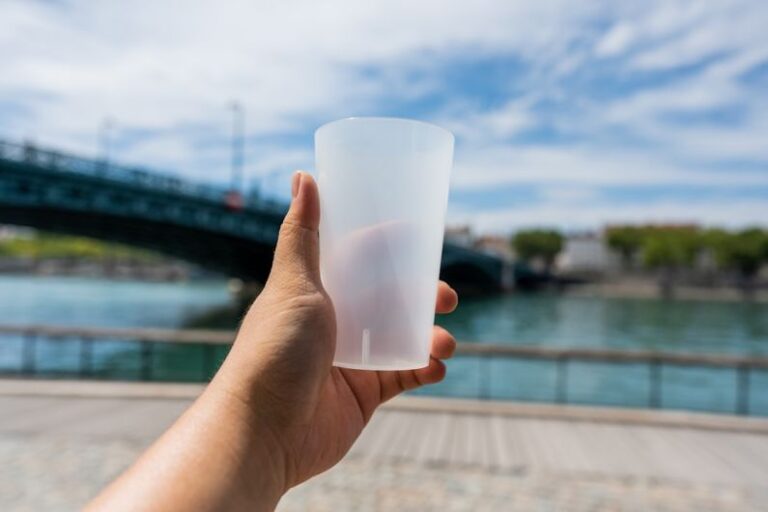Reusable Product - a hand holding a white cup