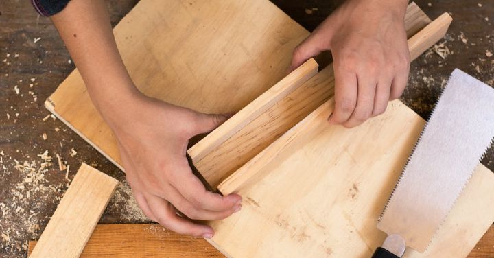 DIY Tools - Person Holding Brown Wooden Chopping Board