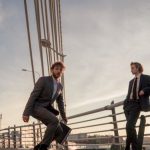 Eco-Friendly Fashion - Man in Black Suit Jacket and Black Pants Standing Beside Woman in Black Blazer