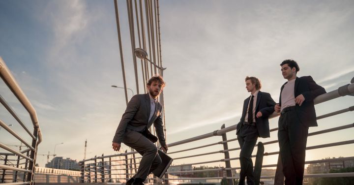 Eco-Friendly Fashion - Man in Black Suit Jacket and Black Pants Standing Beside Woman in Black Blazer
