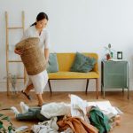 Children's Clothing - Mother and Daughter Playing while Cleaning Up Clothes