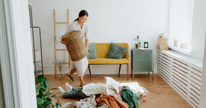 Children's Clothing - Mother and Daughter Playing while Cleaning Up Clothes