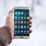 Person Holding Silver Android Smartphone