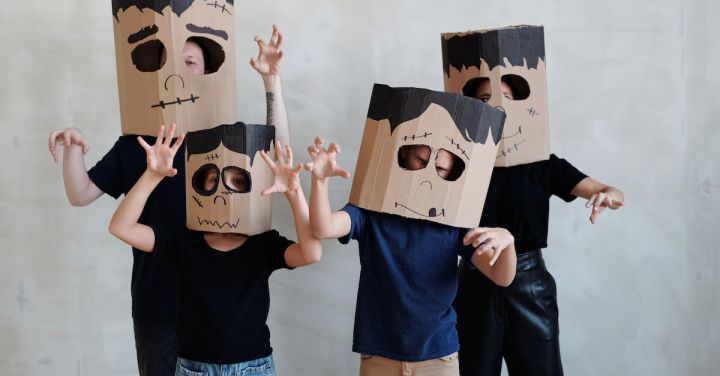Parents DIY - A Family Wearing a Diy Cardboard Box Mask